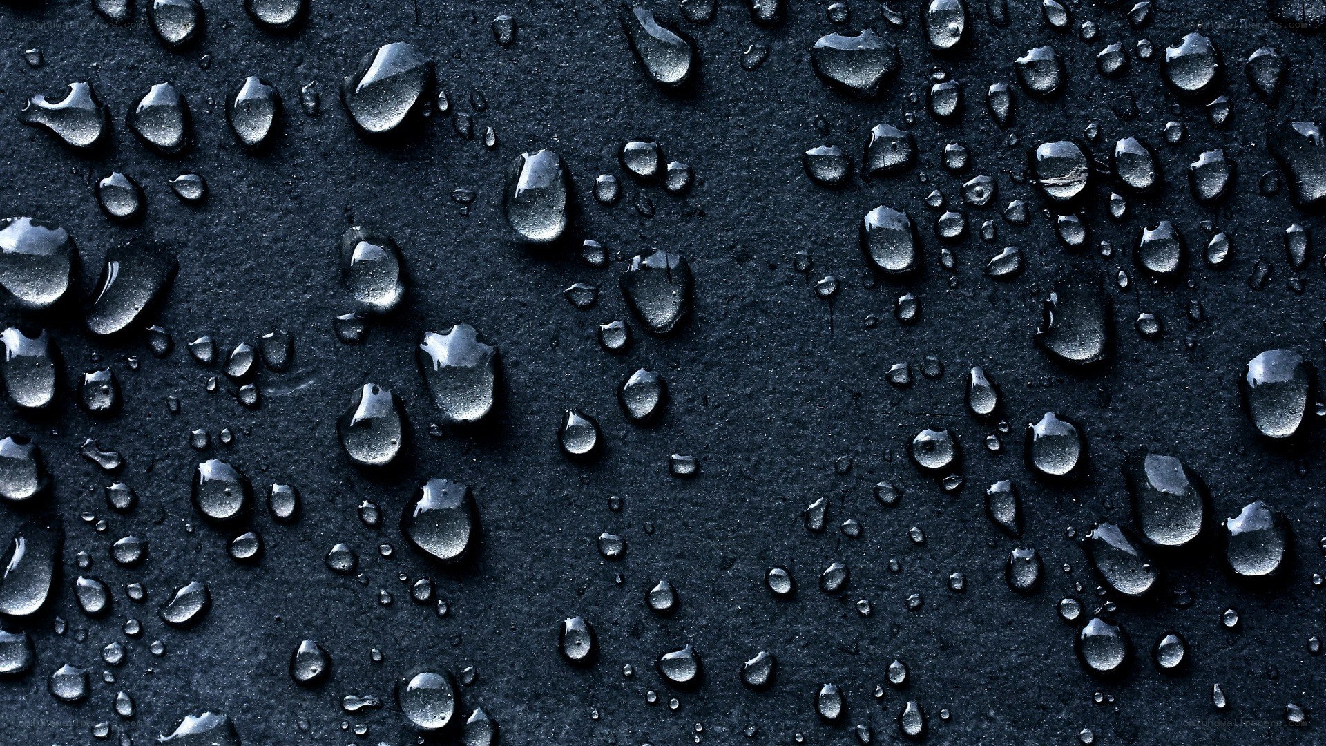 Water droplets on dark surface