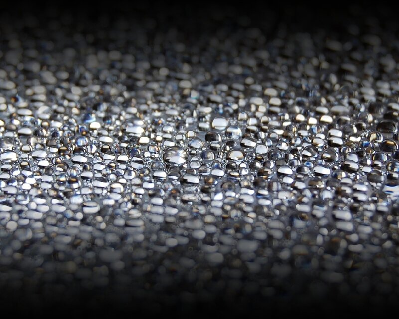 Water droplets on dark surface