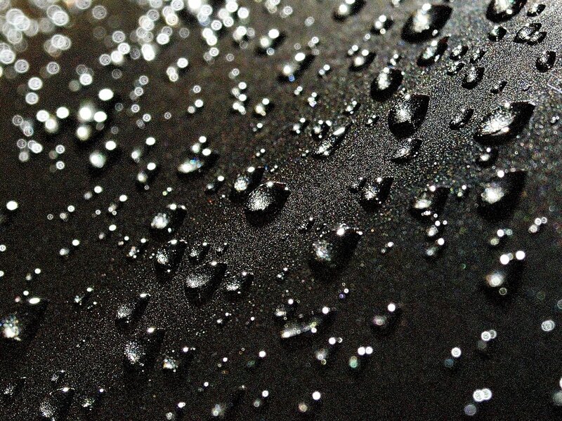 Water droplets on dark surface