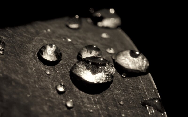 Water Droplets on Dark Surface — Black, Dramatic, Photograph, Droplet