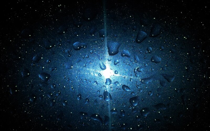 Water droplets on glass at night