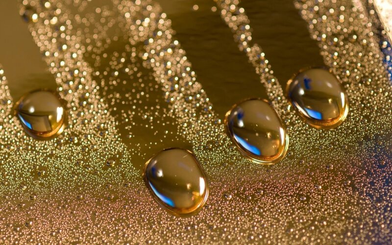 Water Droplets on Gold Surface — Dramatic