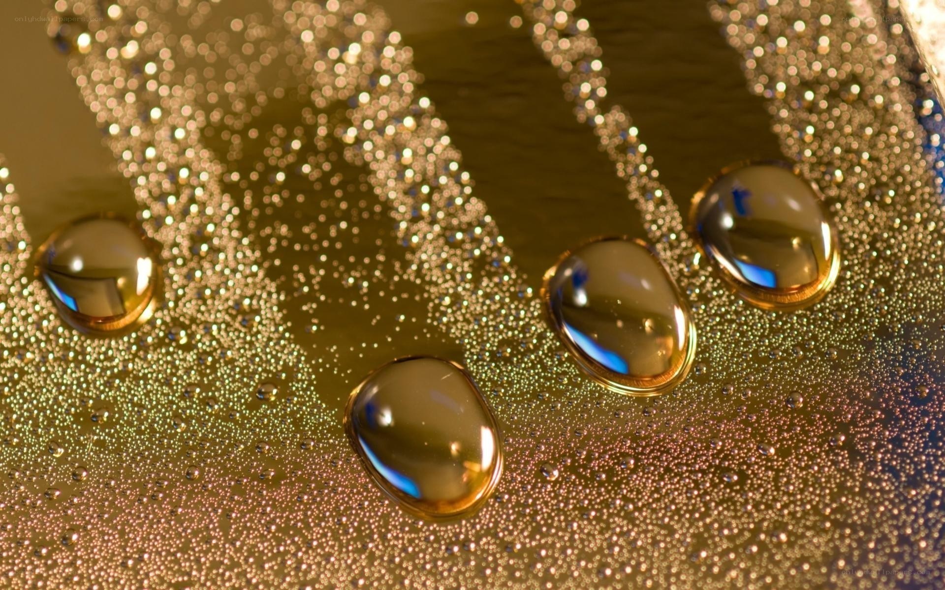 Water droplets on golden surface