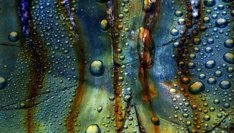 Water droplets on iridescent surface
