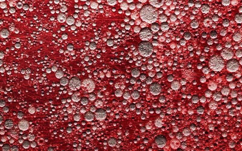 Water Droplets on Red Surface — Textured