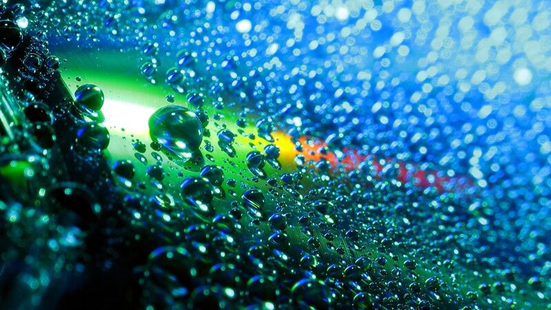 Water Droplets on Surface — Blue, Dramatic, Photograph, Light