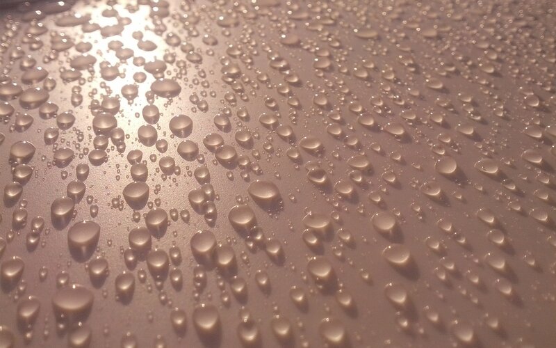 Water Droplets on Surface — Brown