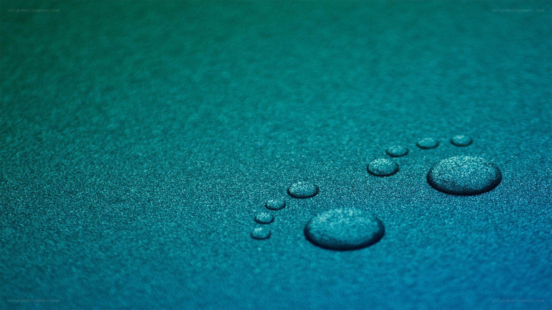 Water droplets on teal surface