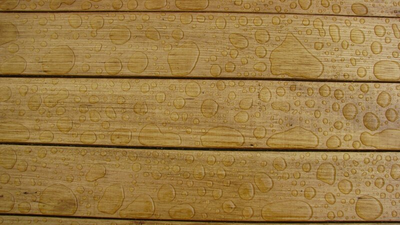 Water droplets on wooden planks