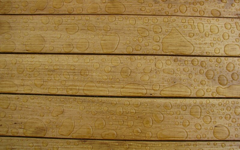 Water droplets on wooden planks