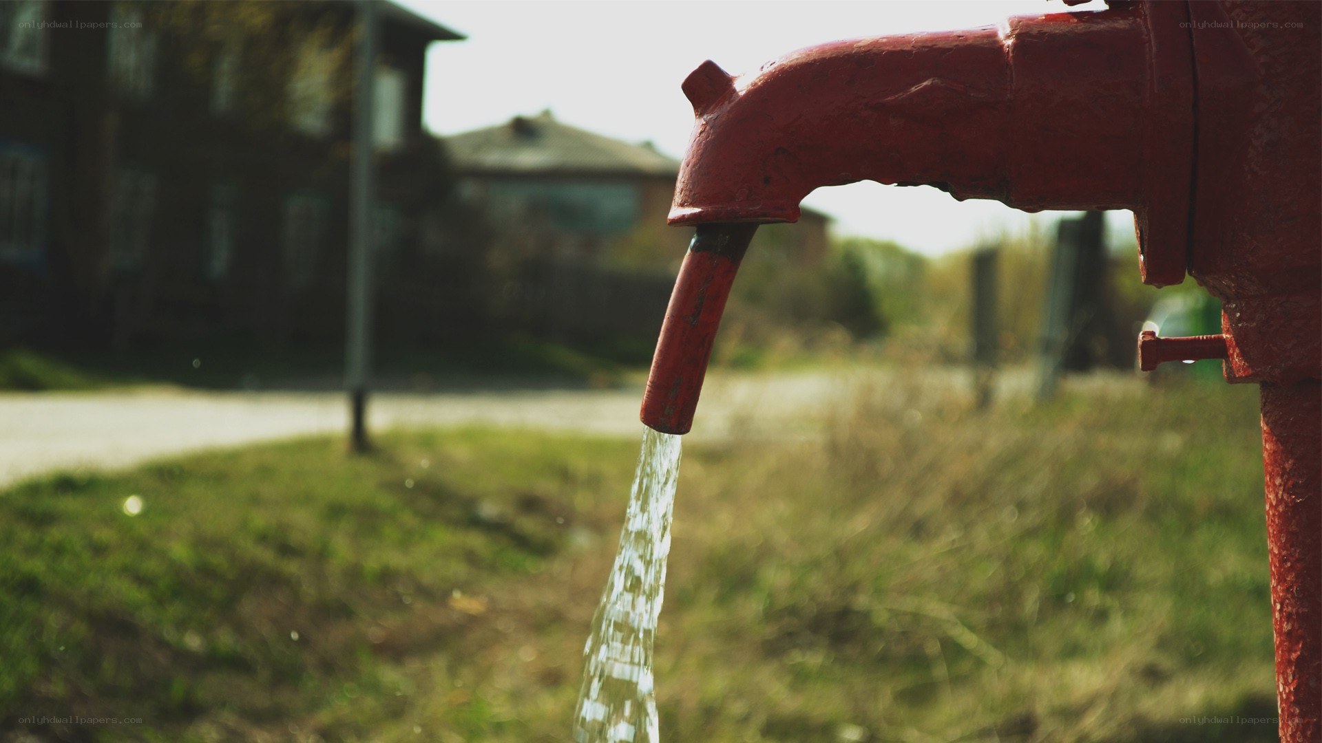 Water flowing from a red hydrant