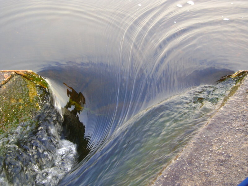 Water flowing over a small dam