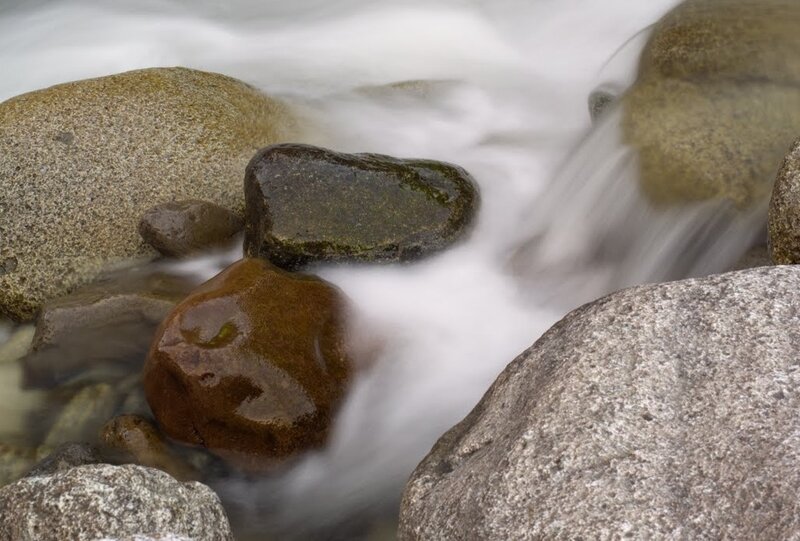 Water flowing over river rocks