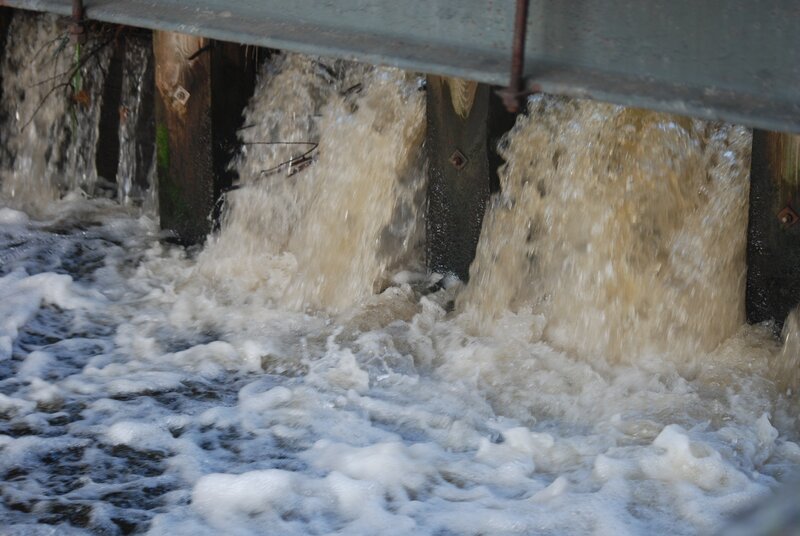 Water flowing through a dam