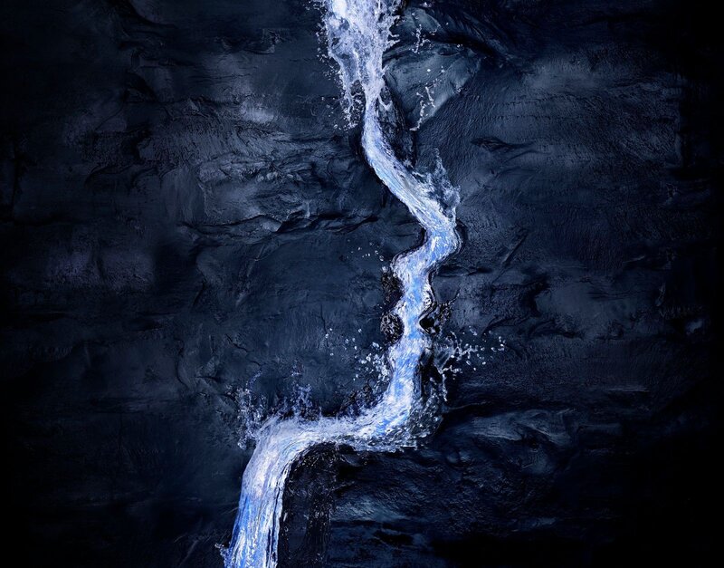 Water flowing through dark rock