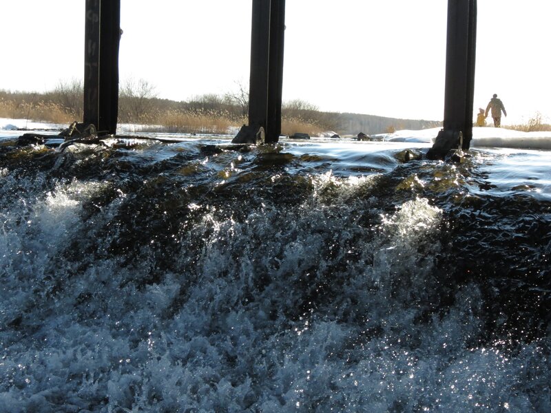 Water flowing under a bridge