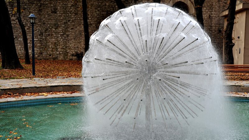 Water fountain sculpture in park