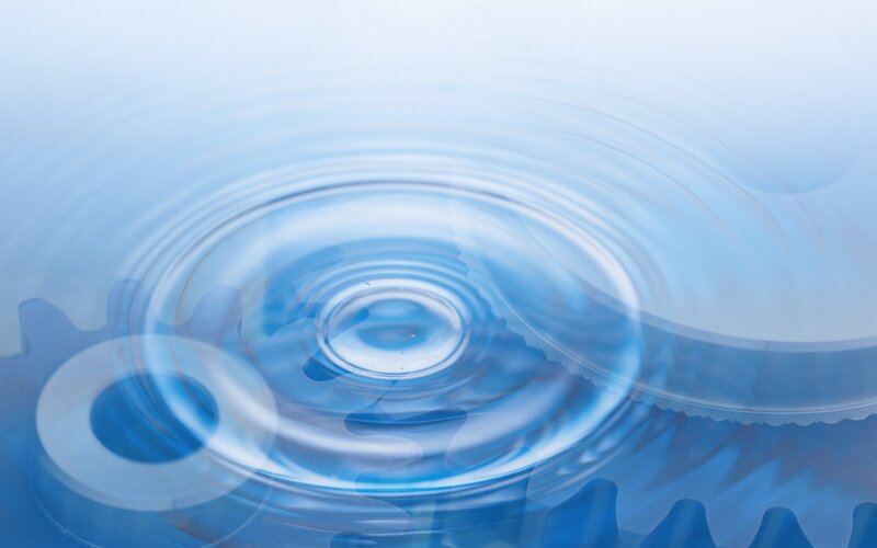 Water ripples with gear overlay