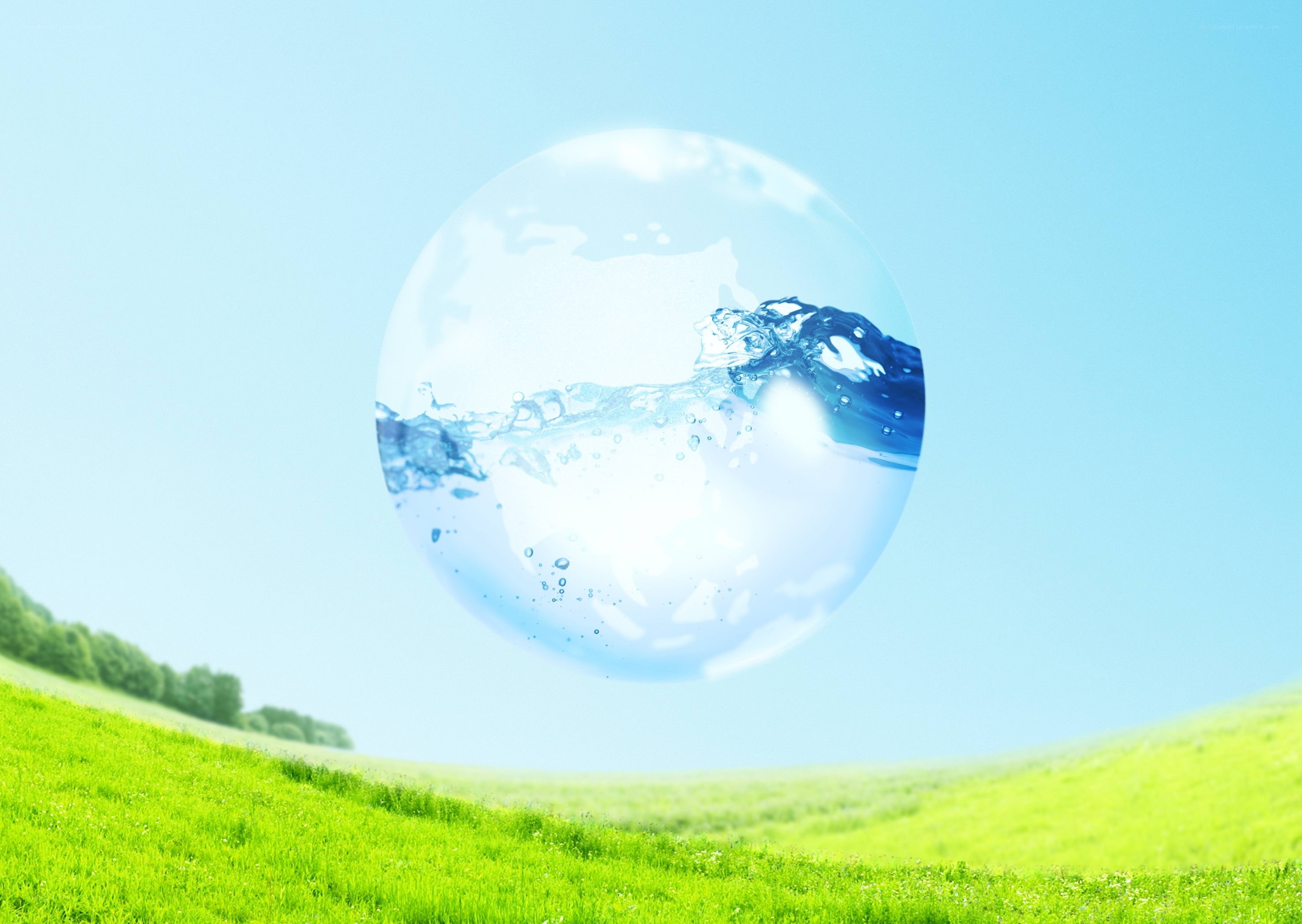 Water sphere over green field