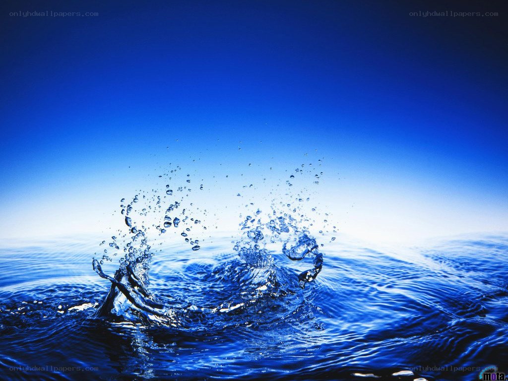 Water splash against blue sky