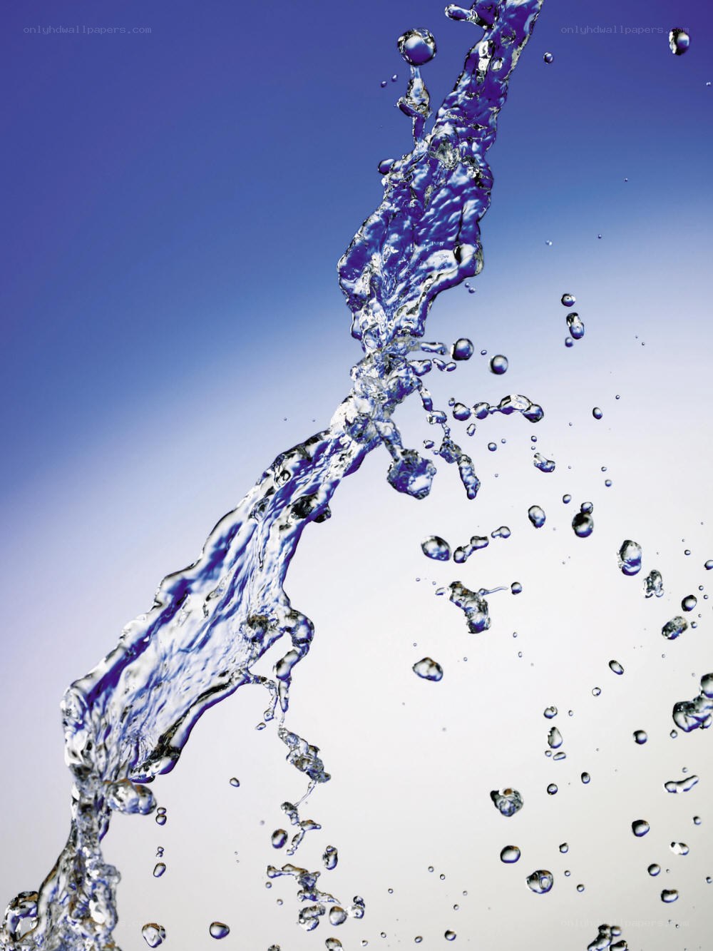 Water splash against blue sky