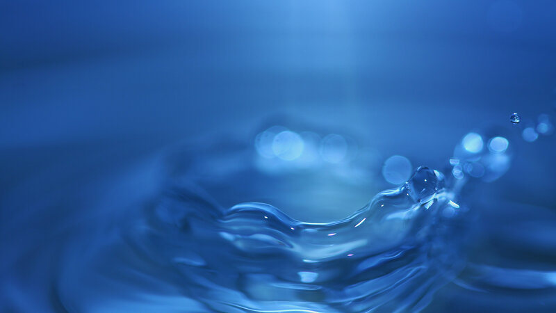 Water splash in blue light