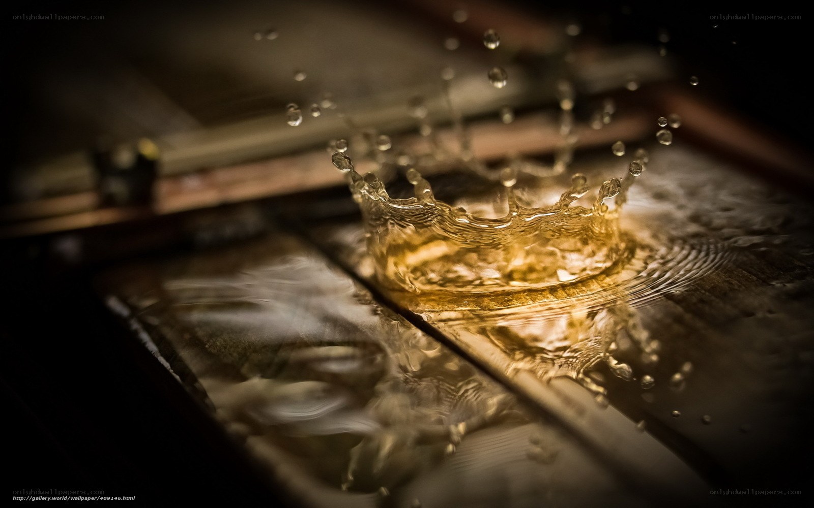 Water splash on wooden surface
