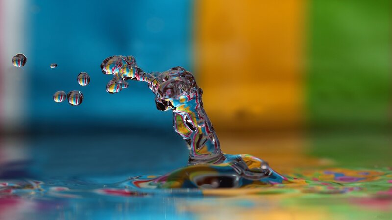 Water splash with colorful background