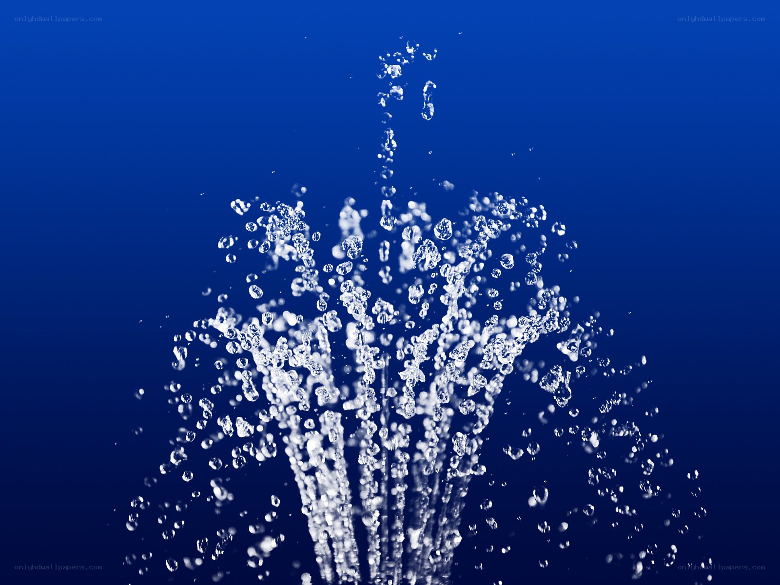 Water splashing against blue