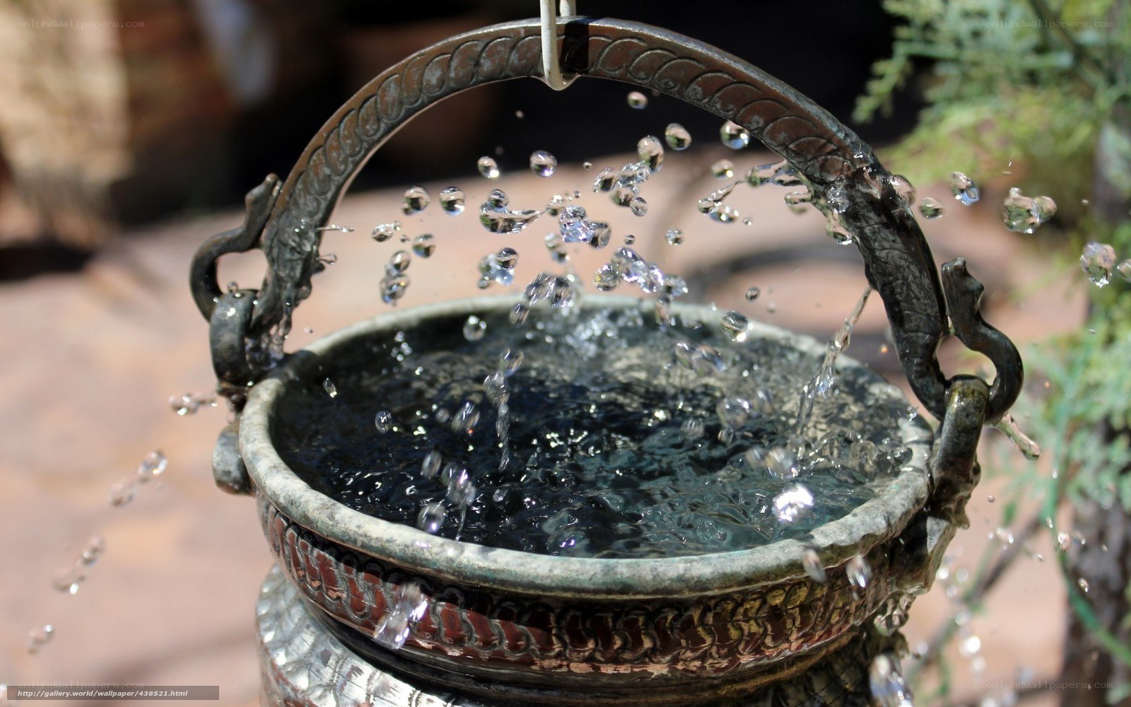 Water splashing from a metal bucket
