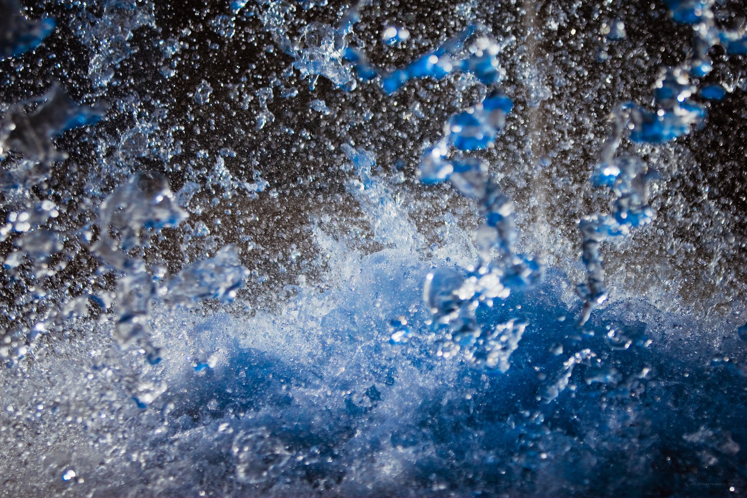Water splashing in blue light