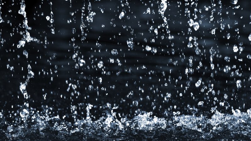 Water splashing in dark setting