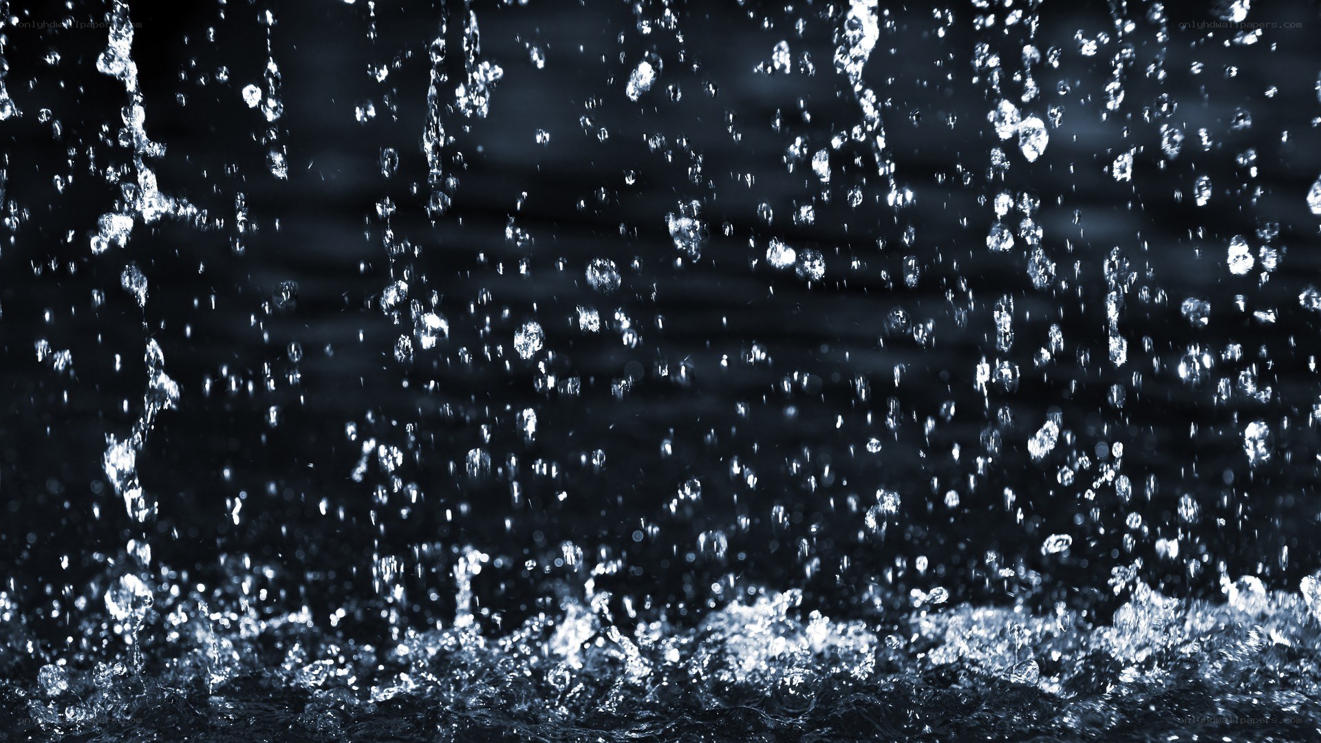 Water splashing in dark setting