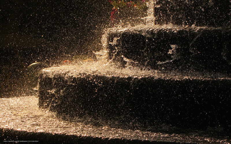 Water splashing in golden light