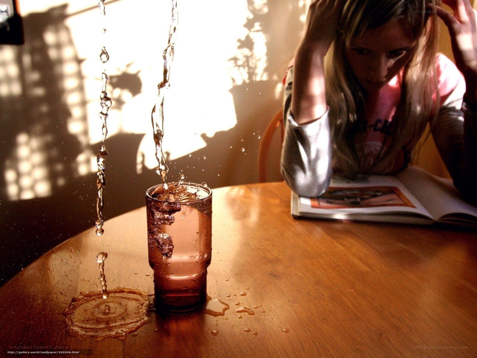Water splashing into a glass