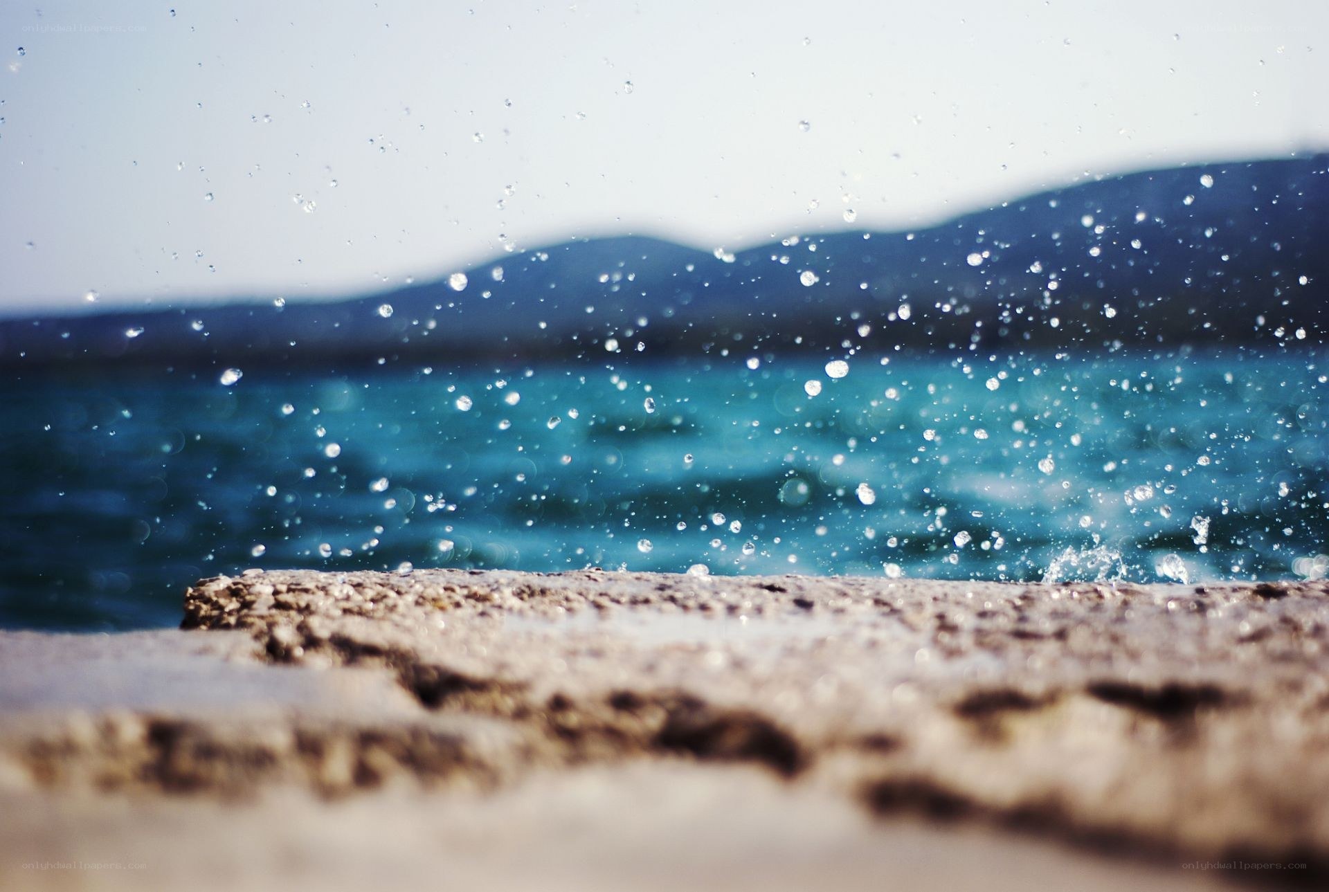 Water splashing on a stone pier