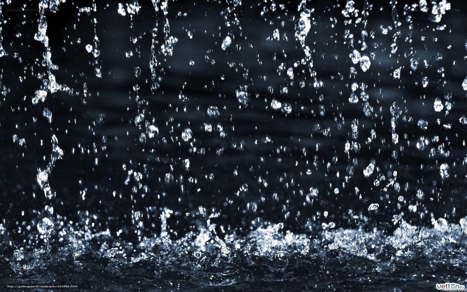 Water splashing on dark surface
