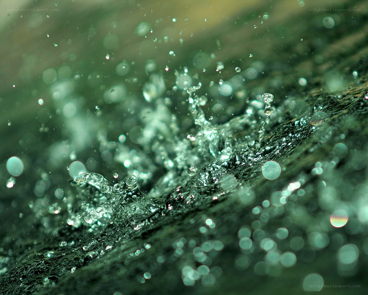 Water splashing on rock