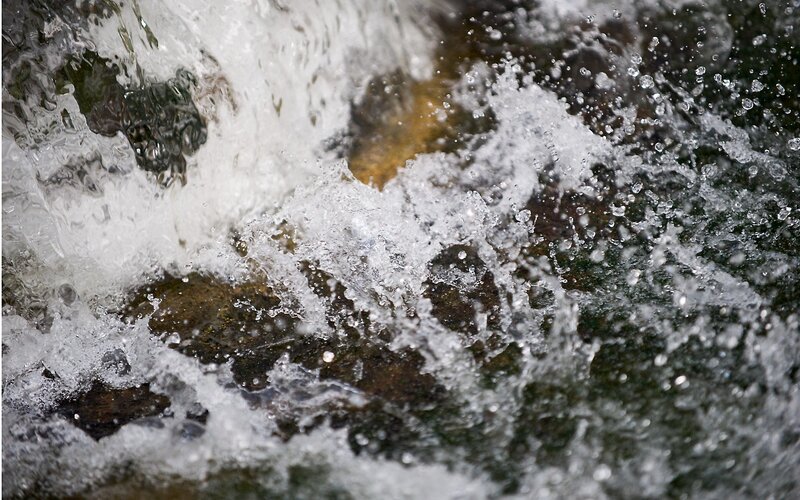 Water splashing over rocks