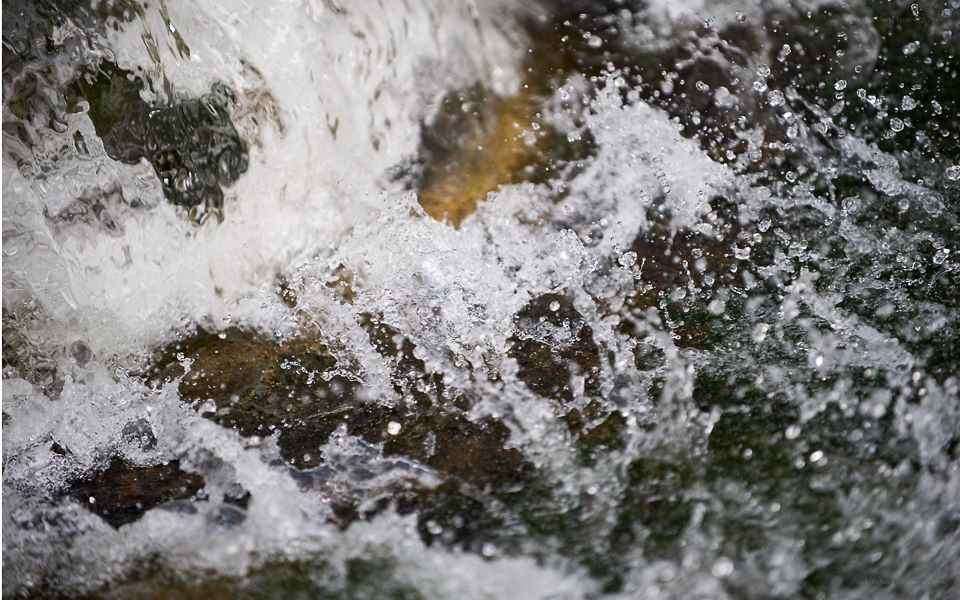 Water splashing over rocks