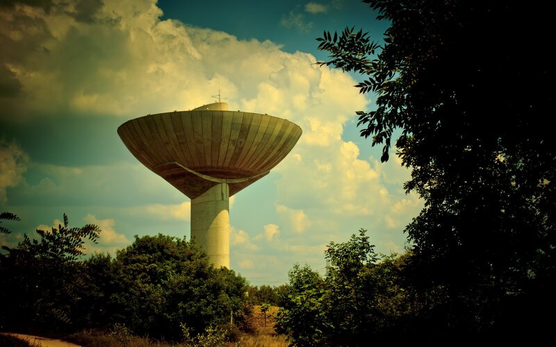 Water tower under cloudy sky