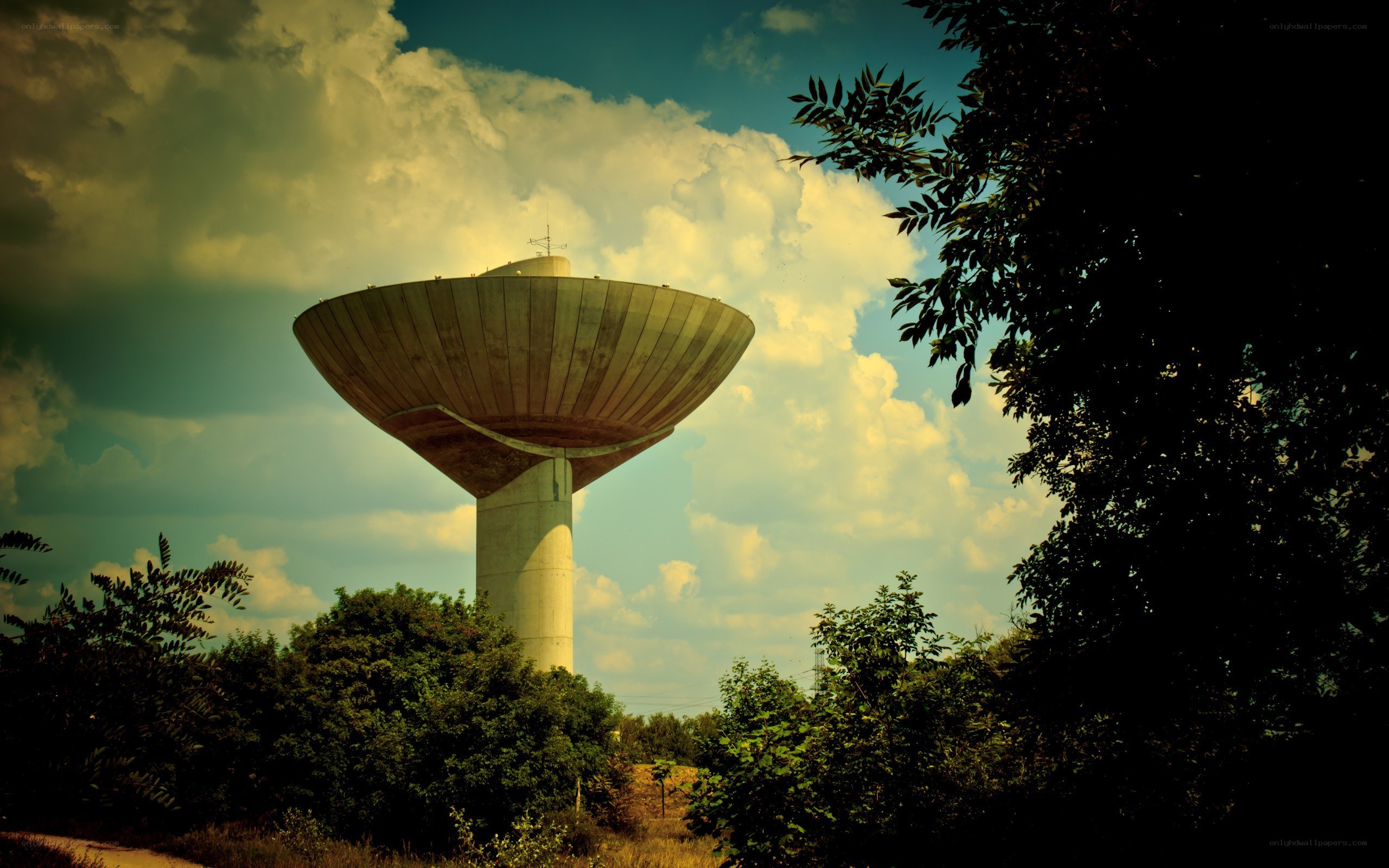 Water tower under cloudy sky
