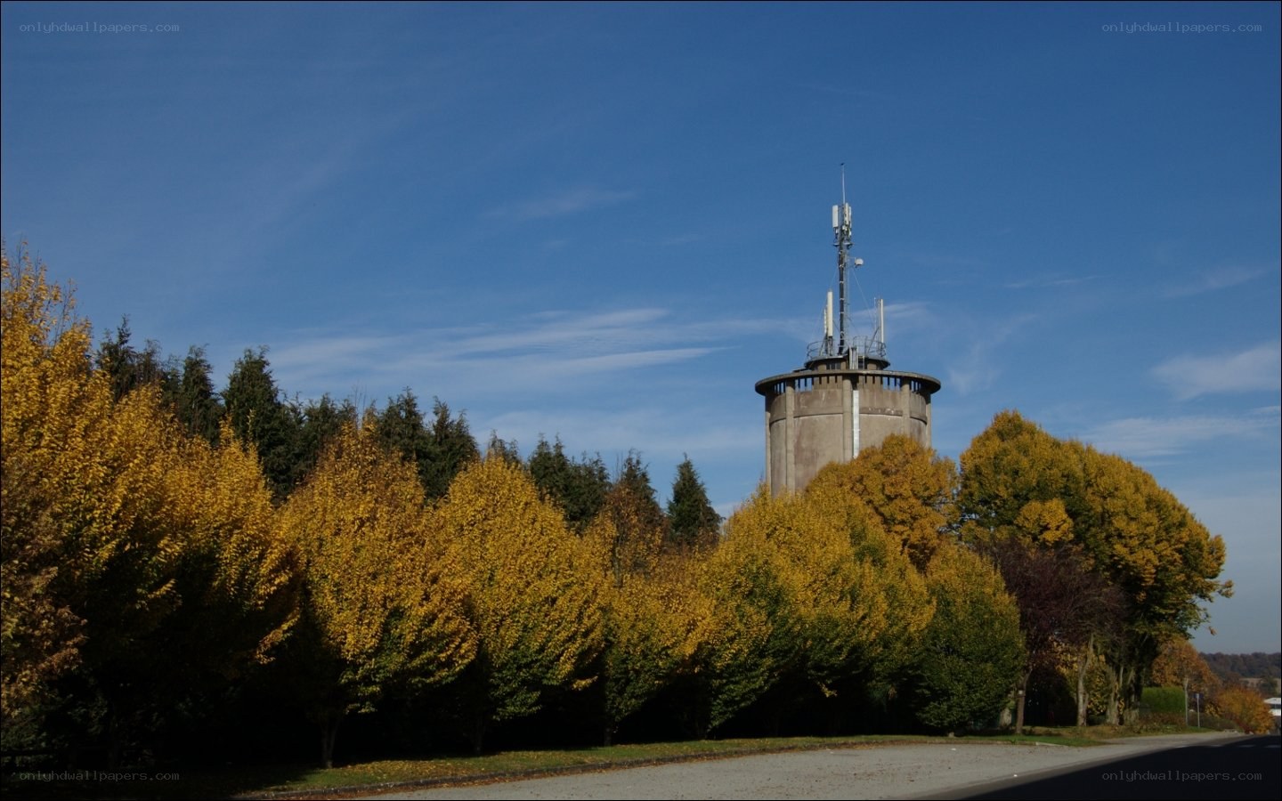 Water tower with autumn trees