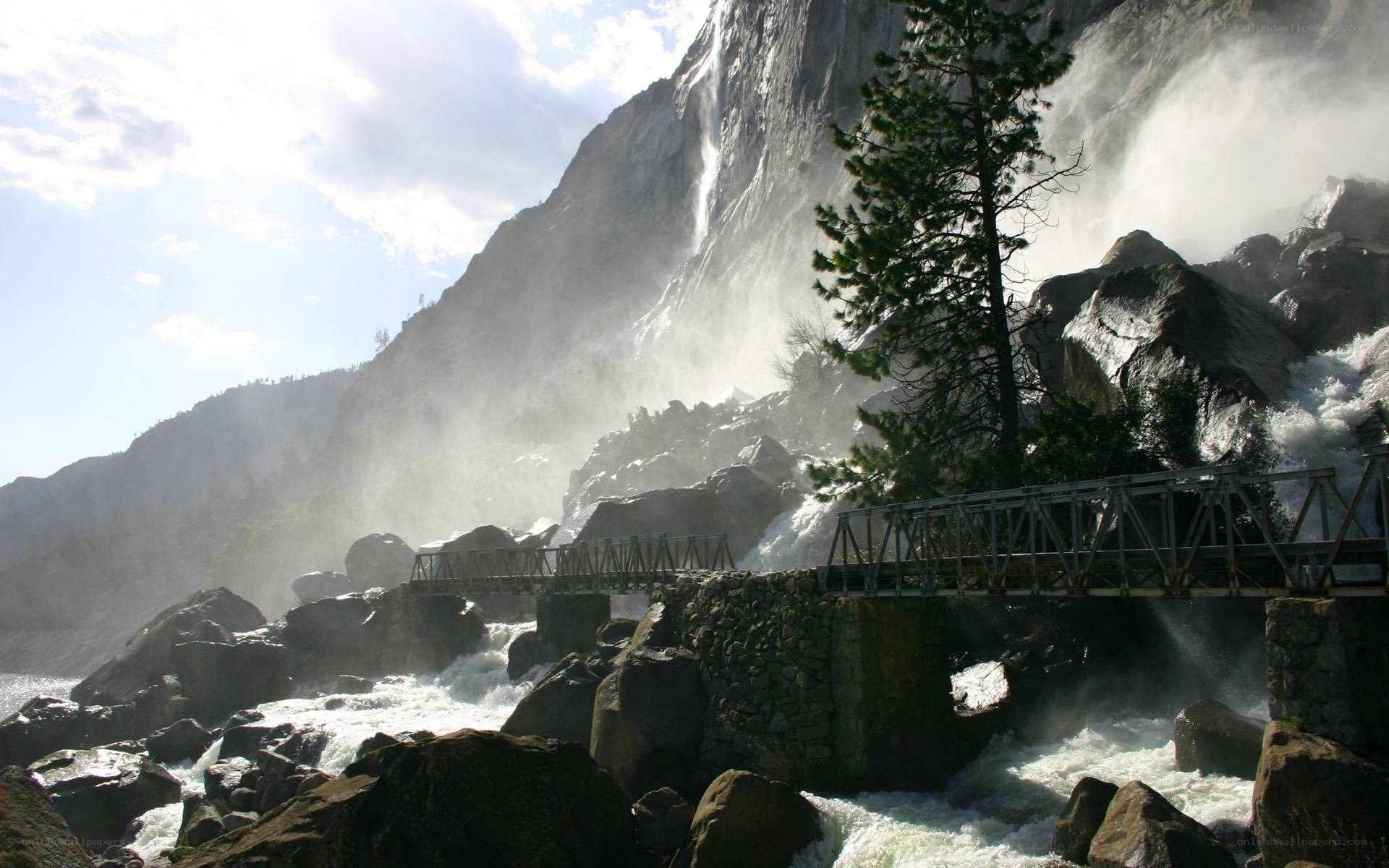 Waterfall and bridge in a canyon