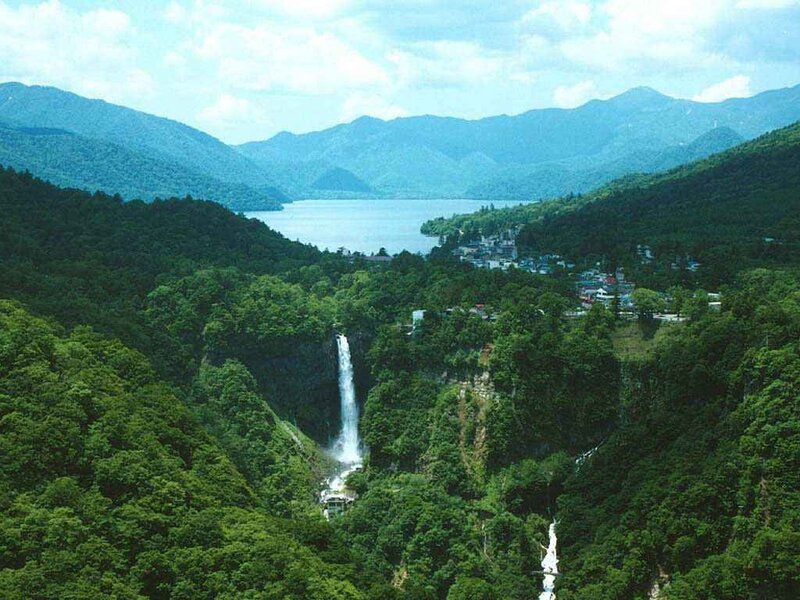 Waterfall and lake in mountain valley