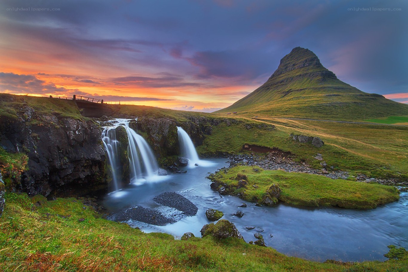 Waterfall and mountain at sunset