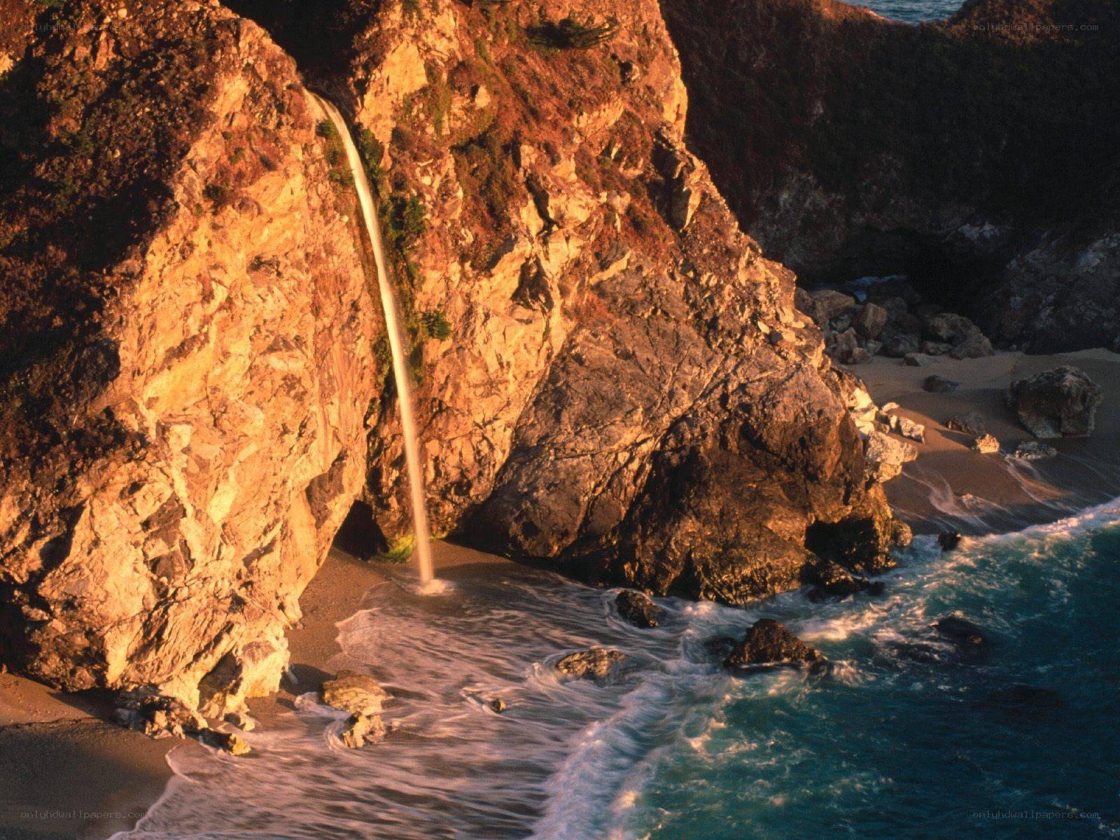 Waterfall at coastal cliff
