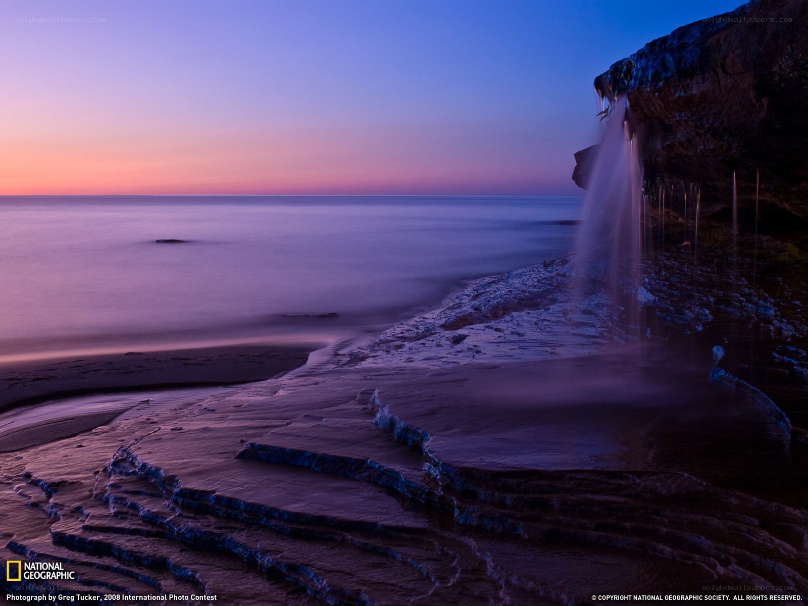 Waterfall at coastal cliff