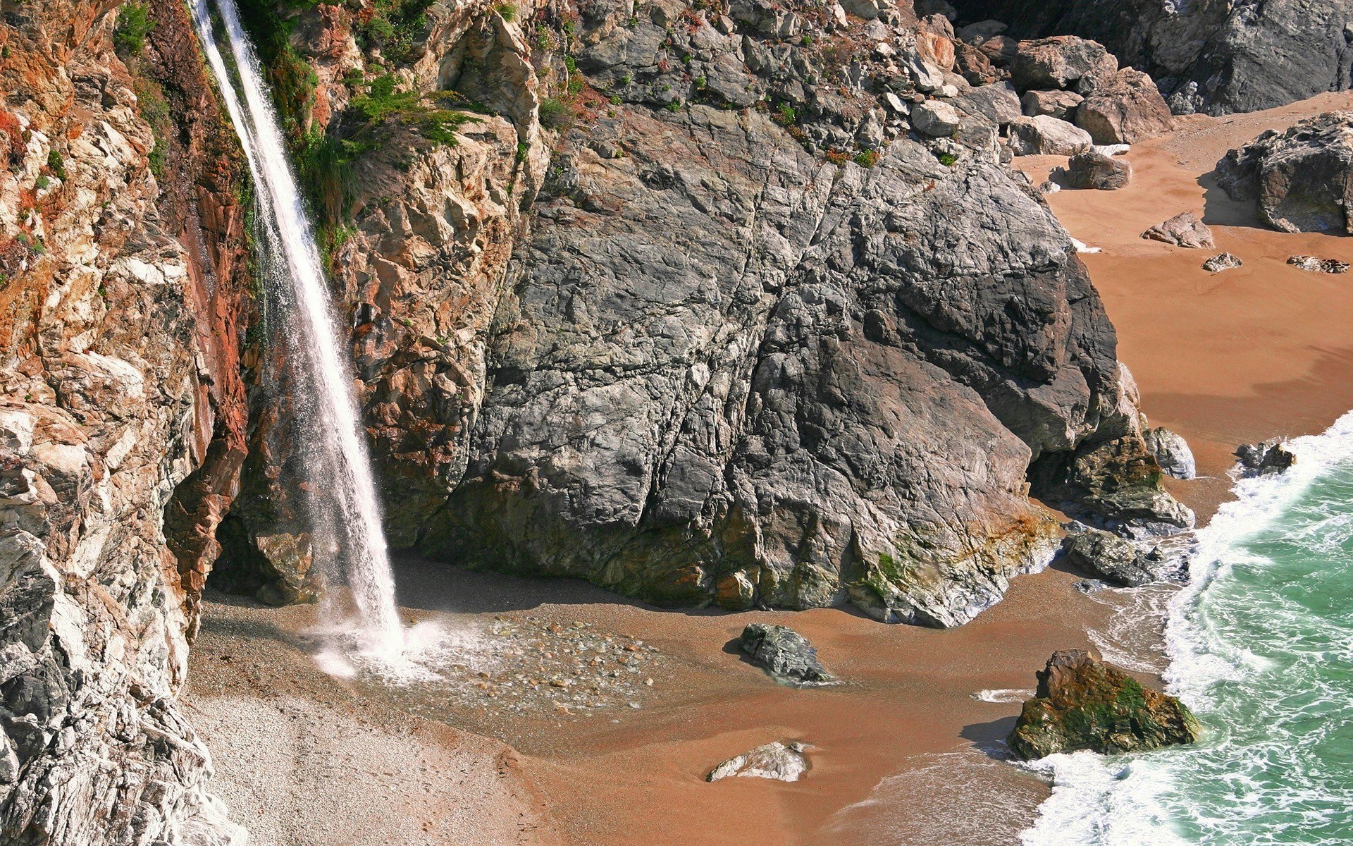 Waterfall at coastal cliff