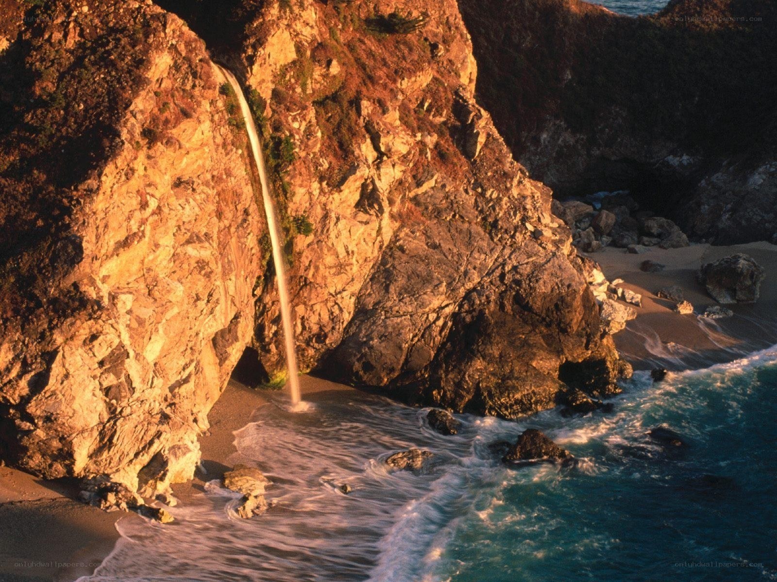 Waterfall at coastal cliff